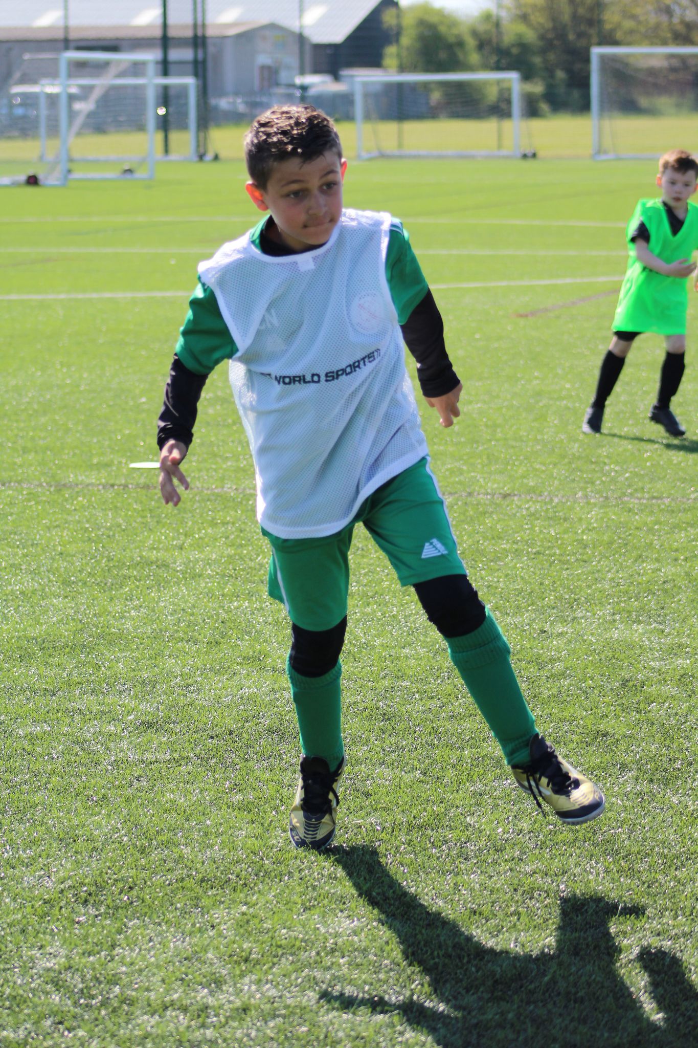 photo from football holiday camp in skgenss - boy waiting to recieve the football