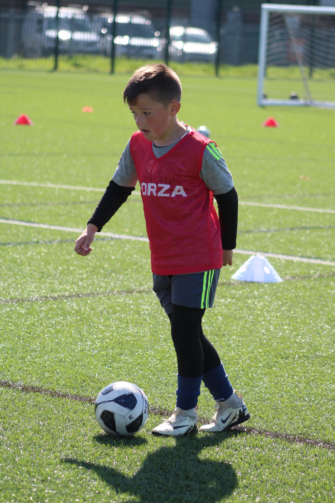 Young boy controlling a football at his feet during a JCSS training session in Skegness