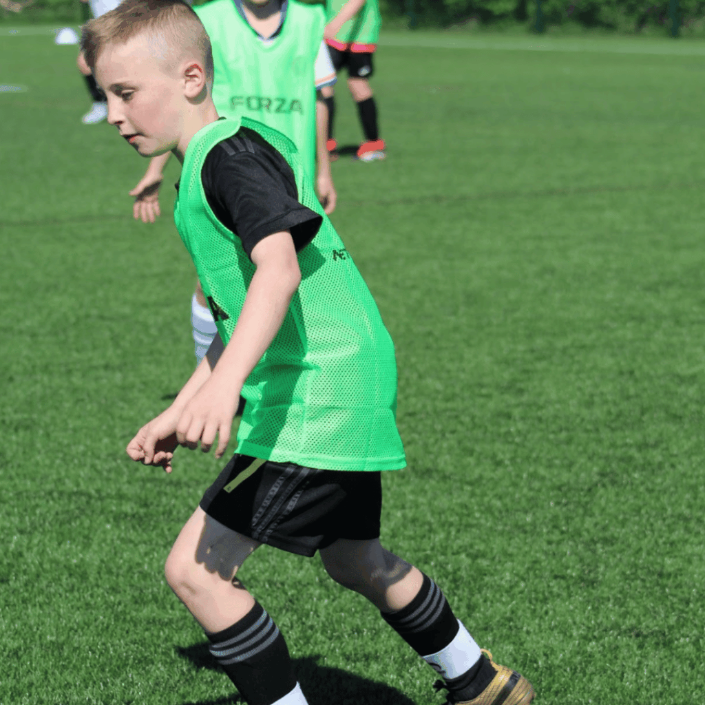 child going for a tackle at jcss development+ in skegness