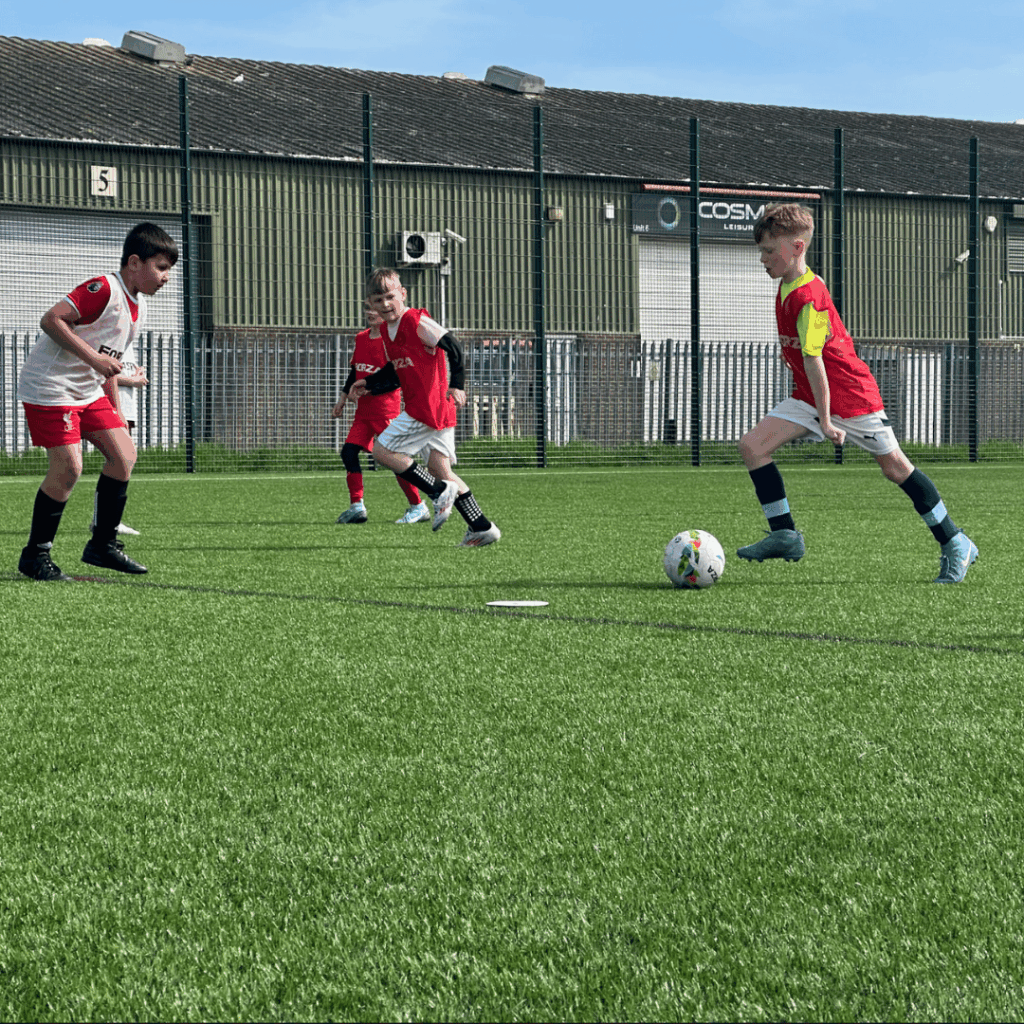 children passing the ball between eachother on attack in jcss development+ skegness