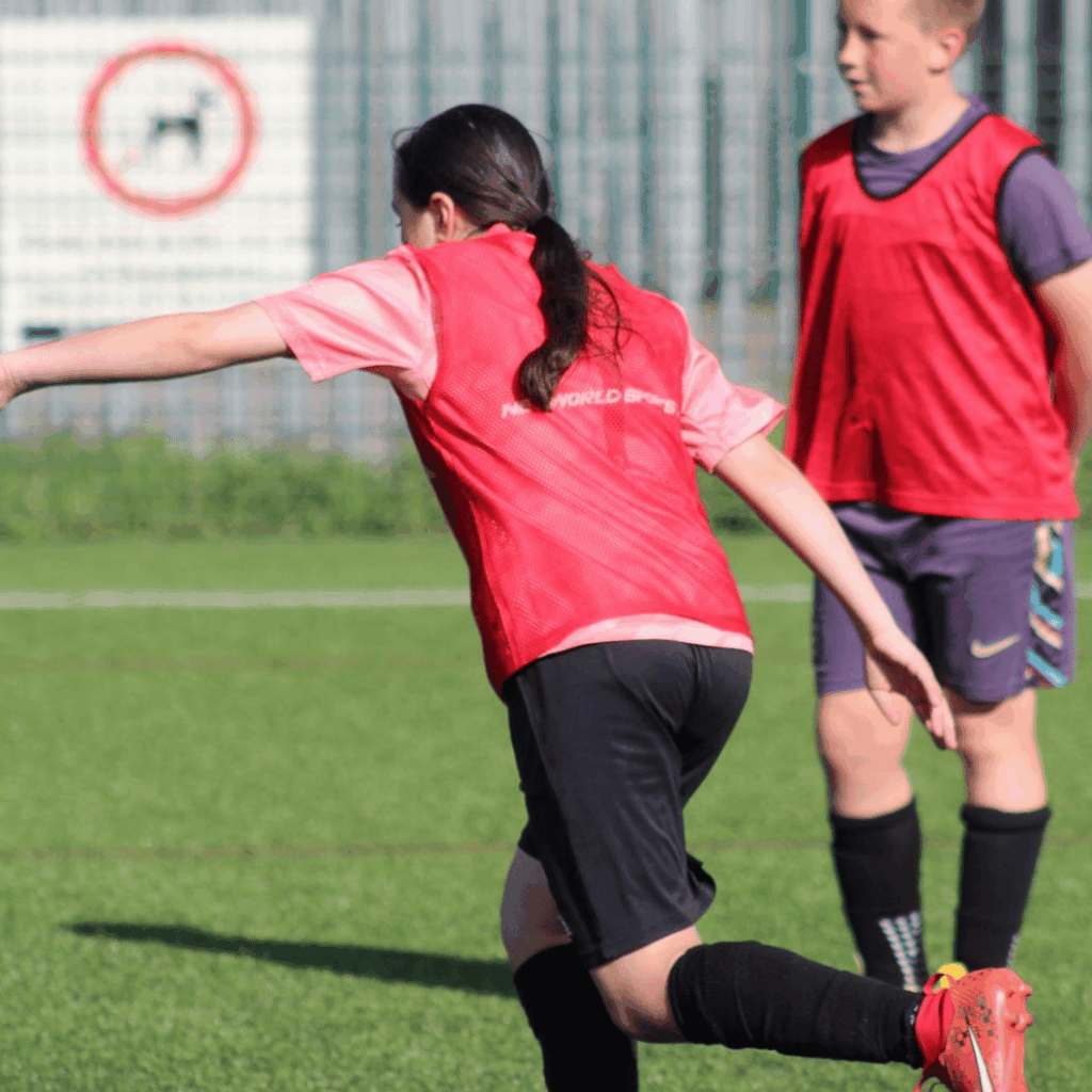 girl taking a freekick at jcss develpment + soccer school in skegness