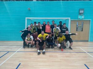 Jack with his futsal team, coaching and mentoring players