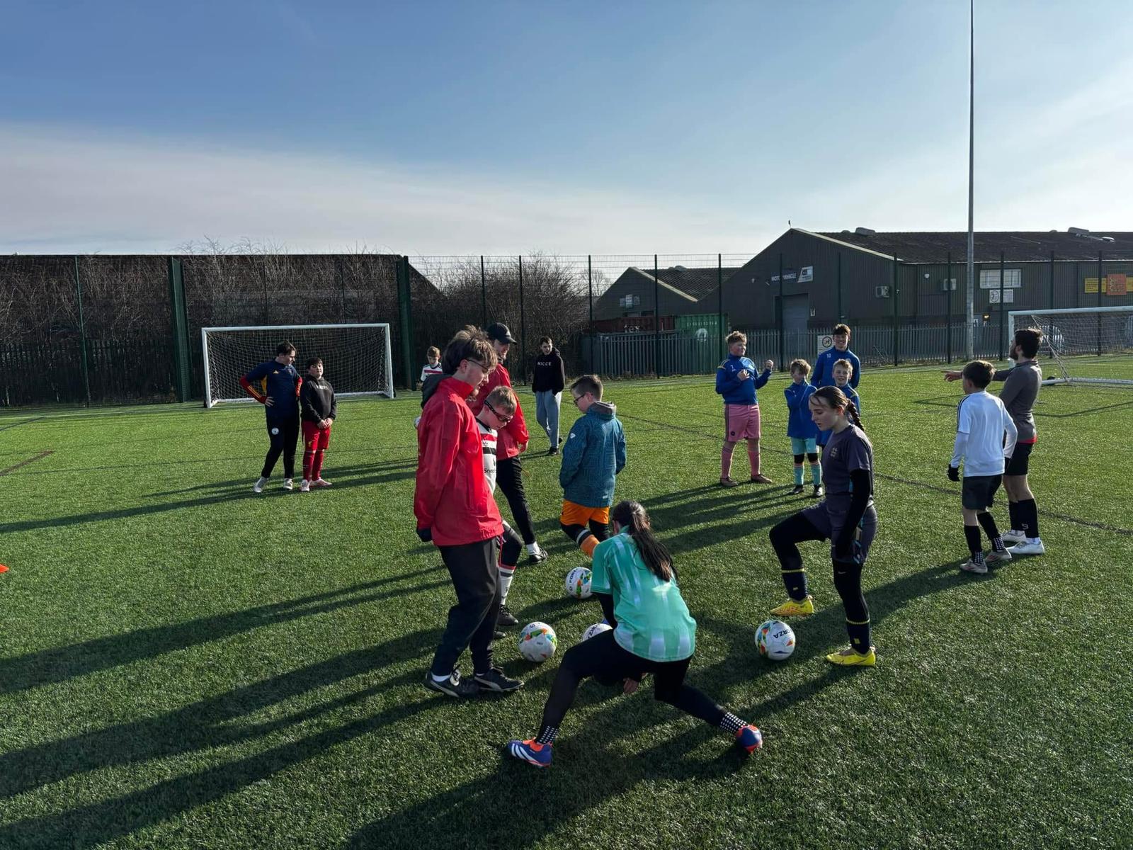 Children and coaches taking part in a JCSS summer football camp in Skegness