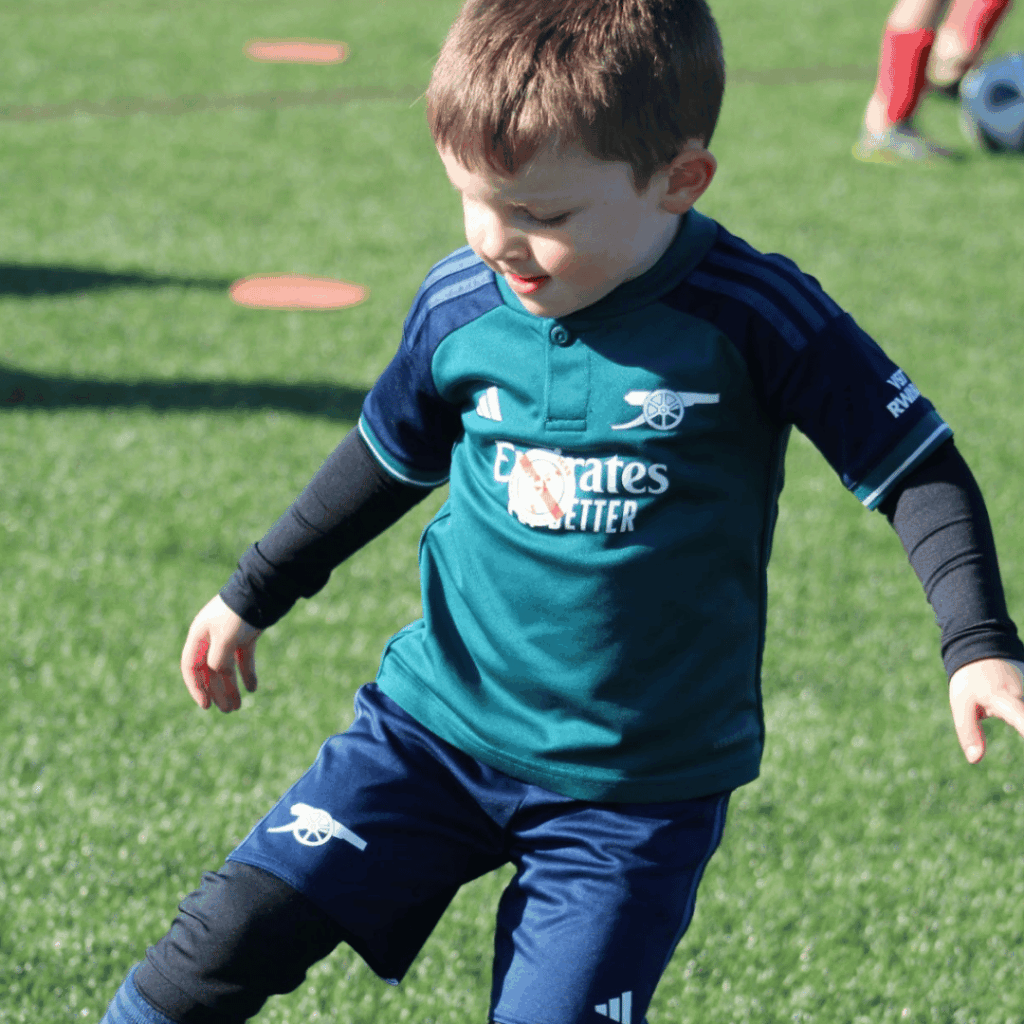 young child from jcss playmakers doing a skill move at the soccr school in skegness