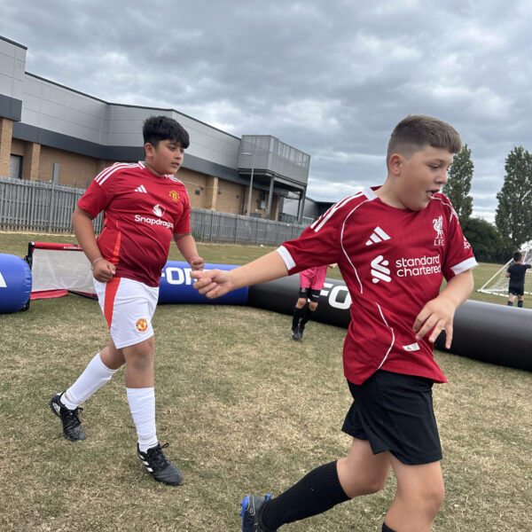 jcss-players-running-red-kit-01